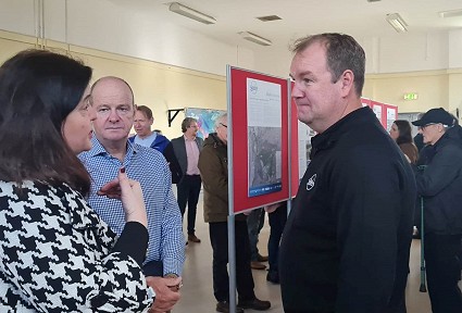 Sioned talking to two men at the skyline event
