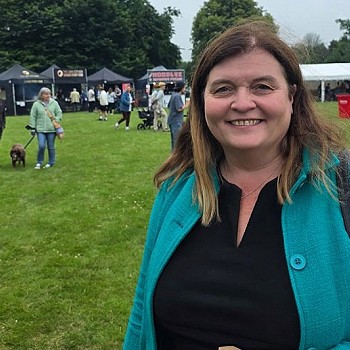 sioned williams smiling in a field
