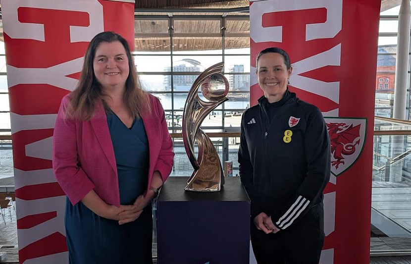Sioned Wiliams standing next to the welsh trophy