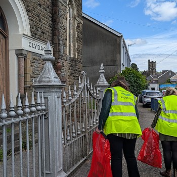 Sioned picking litter outside a church