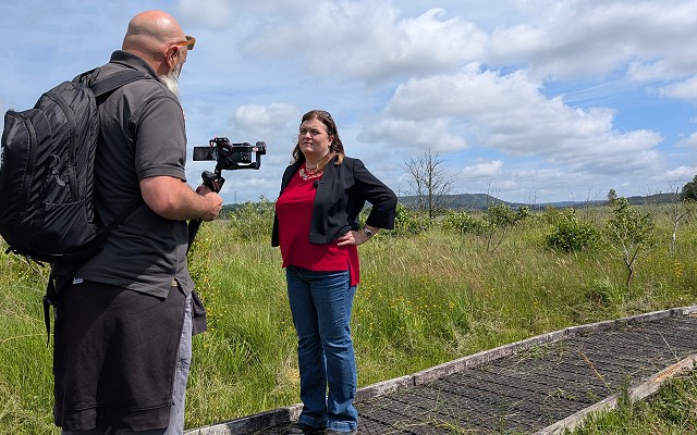 sioned williams next at Crymlyn bog speaking to a man filiming