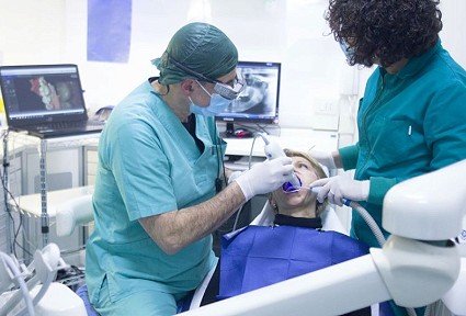 Dentist treating patient