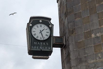 Clock hanging outside the Neath Marks and Spencer's