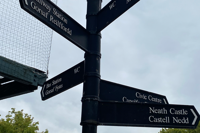 Sign post showing places to go in Neath