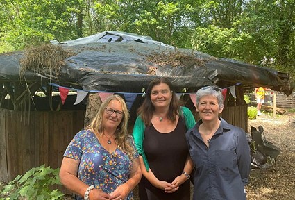 Three ladies outside in a garden