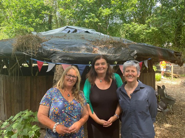 Three ladies outside in a garden