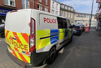 Police van parked on side of road
