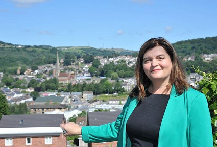 Sioned in a green jacket with Pontardawe behind