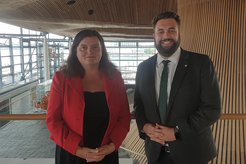 Sioned Williams MS and Luke stanging in the Neuadd of the Senedd